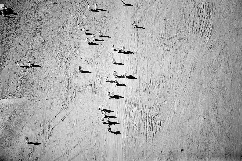 Helicopter view of women pilgrims walking in the desert on their way to Mount Arafat, where Mohammad became a prophet.